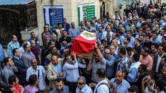 جنازة لقائد الشرطة المصري الذي قتل في كمين نصله مسلحون -أ ف ب