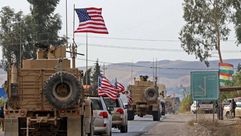 مركبات عسكرية أمريكية بالقرب من بردرش في العراق بعد انسحابها من شمال سوريا - جيتي