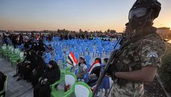 مسلح من الحشد خلال مهرجان انتخابي لمليشيات عصائب أهل الحق- جيتي