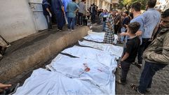 جثث شهداء غزة مكدسة في الشوارع- جيتي