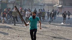 اشباكات بين متظاهرين عراقيين وقوات الأمن - جيتي