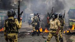 مصر - قوات الأمن - الجيش -  مظاهرات جمعة الشعب يشعل ثورته 3-1-2014 (الأناضول)