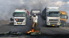 احتجاجات  العراق  الحكومة  بغداد  شاحنات- جيتي