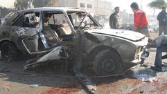 سيارة متفحمة بفعل البراميل المتفجرة في حلب - الأناضول