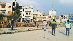 خروج مدنيين من حي الوعر حمص بموجب اتفاق بين الثوار والنظام -- سوريا - عربي21 (3)