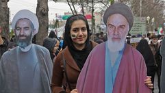فتاة إيرانية خلال الاحتفالات بذكرى الثورة- جيتي