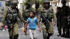 اعتقال طفل في فلسطين - أ ف ب