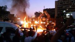 وقفة احتجاجية مفاجئة لطلاب مؤيدين لمرسي في ميدان رابعة العدوية - الأناضول