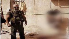 العميد في الحرس الجمهوري عصام زهر الدين - مع بقايا جثتين من تنظيم الدولة - دير الزور سوريا