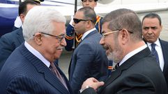 محمود عباس ومحمد مرسي- جيتي