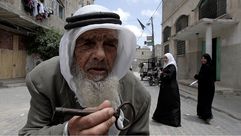 لاجئ فلسطيني يحمل مفتاح بيته الذي هجر منه عام 1948- جيتي
