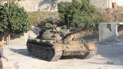 دبابة للثوار تستعد لقصف مواقع النظام على محور كنسبا - جبل الأكراد ريف اللاذقية - سوريا - عربي21