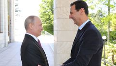 الأسد و بوتين - جيتي