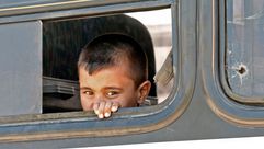 لاجئ سوري في حافلة مغادرة من بيروت عائدة إلى سوريا - جيتي