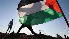 علم فلسطين مع المقاومة (الأناضول)