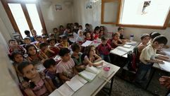 تلاميذ في مدرسة تحت الأرض - حلب - سورية 6-9-2014 (أ ف ب)