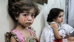 أطفال ضحايا قصف النظام السوري على الغوطة - الأناضول