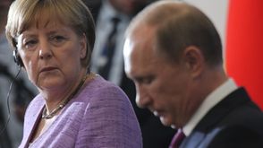 بوتين ميركل روسيا  ألمانيا