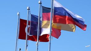 أعلام تركيا وروسيا وألمانيا وفرنسا- الأناضول