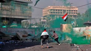 اشتباكات بين قوات الأمن العراقية والمتظاهرين المناهضين للحكومة في بغداد - أ ف ب