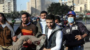 مصر - مصاب في مظاهرات جمعة التحدي الثوري 24-1-2014 (الأناضول)