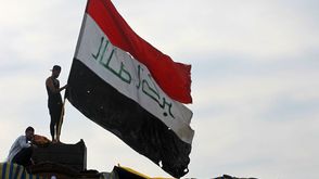 العراق  علم  احتجاجات  بغداد- جيتي