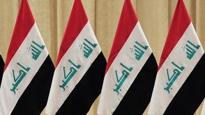 العراق  أعلام  (الأناضول)