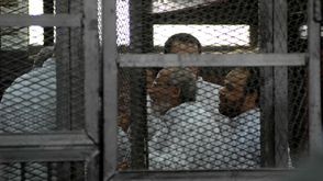 قيادات الاخوان في مصر خلال احدى المحاكمات - قيادات الاخوان خلال جلسة محاكمة - الاناضول  (9)