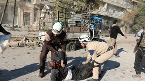 رجال الدفاع المدني يساعدون المدنيين بعد قصف روسي على حلب سوريا - أ ف ب 8-2-2016