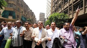 نقيب الصحفيين السابق وعضوي النقابة عبد الرحيم والبلشي- جيتي
