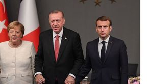 ميركل وأردوغان وماكرون- جيتي