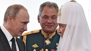 بوتين مع بطريرك الكنيسة الأرثوذكسية- جيتي