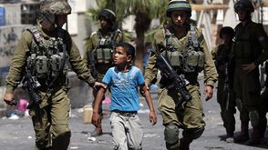 اعتقال طفل في فلسطين - أ ف ب