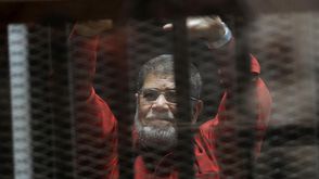 مرسي يظهر بالبدلة الحمراء - مرسي بالبدلة الحمراء - الأناضول (2)
