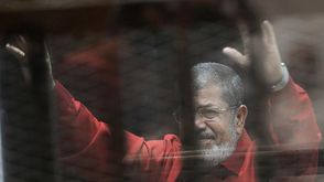 مرسي يظهر بالبدلة الحمراء - مرسي بالبدلة الحمراء - الأناضول (3)