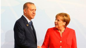 أردوغان و ميركل - جيتي