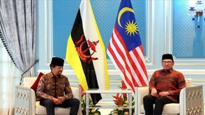 رئيس وزراء ماليزيا انور ابراهيم وسلطان بورناي - الاناضول