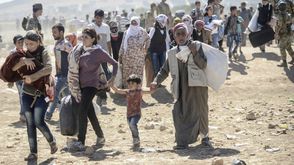 أكراد سوريا يهربون إلى تركيا مع تقدم داعش ـ أ ف ب