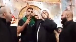 طانيوس ردد الشهادتين خلف المعمم الشيعي- فيس بوك