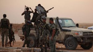 عناصر من النظام السوري زعمت سانا أنهم بمطار الطبقة العسكري- سانا