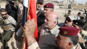 العبادي رفع العلم العراقي فوق منفذ حصيبة الحدودي مع سوريا- مكتب رئيس الوزراء العراقي