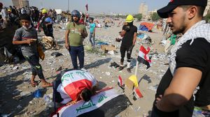 يشهد العراق منذ 25 تشرين الأول/ أكتوبر الماضي، موجة احتجاجات متصاعدة مناهضة للحكومة- جيتي