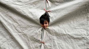 لاجئة سورية: المعاطف والأغطية وحدها لا تكفي لحمايتنا من البرد في مخيم الزعتري- أرشيفية (ا ف ب)