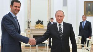 بوتين والأسد في لقاء سابق في موسكو- أ ف ب 