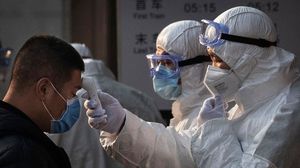 الصين قالت إن عدد ضحايا الفيروس وصل إلى 213 شخصا- جيتي