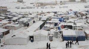 الثلوج تغطي مخيم اللاجئين السوريين في عرسال اللبنانية - الأناضول