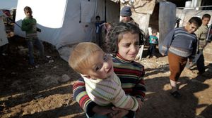أطفال في مخيم دارة عزة في حلب (الأناضول)