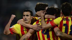 لاعبو برشلونة يحتفلون بالهدف الرابع بمرمى خيتافي - ا ف ب