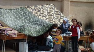  لاجئون سوريون هربوا خوفا من الحرب الدائرة في بلادهم - ا ف ب