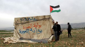 ناشطون يعيدون إحياء قرية "بوابة العودة" - الأناضول